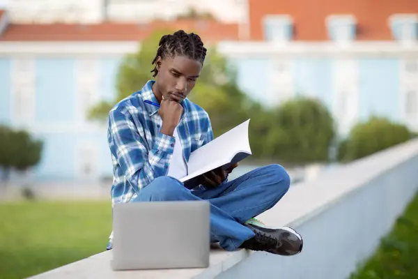 A student writing their scholarship application